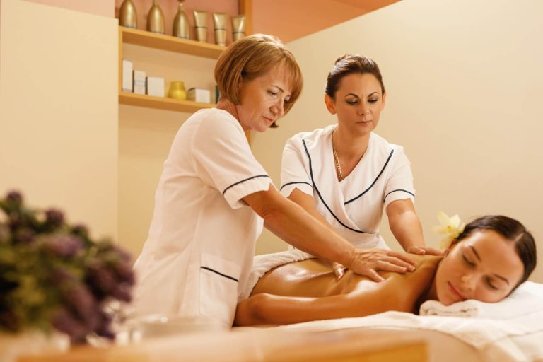 enjoying a relaxing deep body massage in Dubai at a luxury spa.